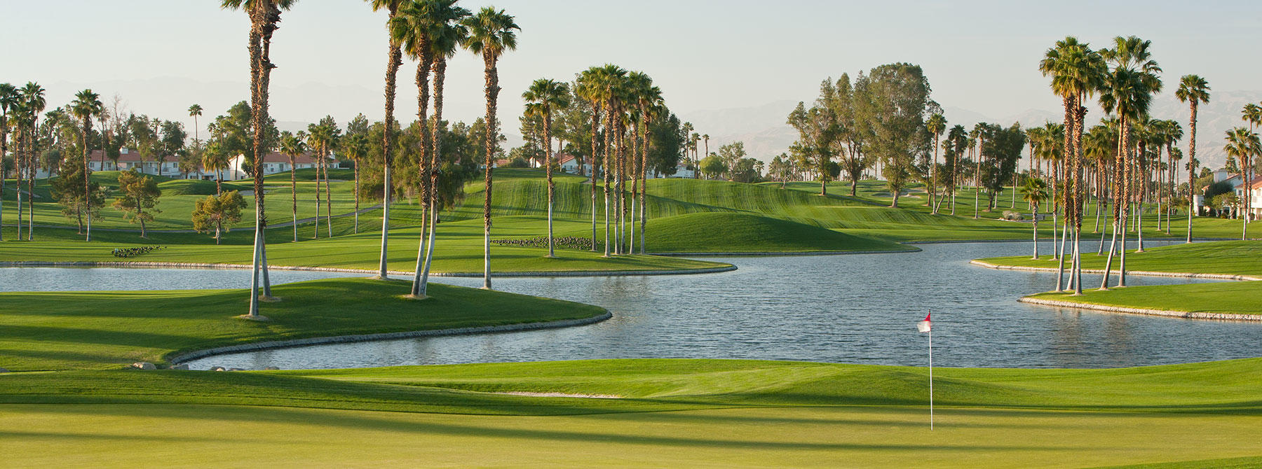 Course greens with lake 